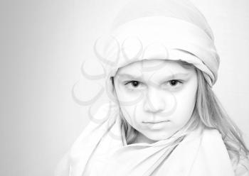 Closeup monochrome portrait of little blond girl in white