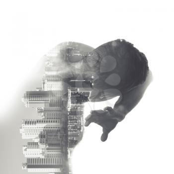 Young muscular Caucasian man covers his face from some abstract danger over abstract day and night cityscapes background, multi exposure photo effect