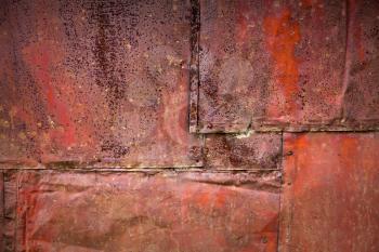 Bright red rusted metal wall detailed grunge background texture