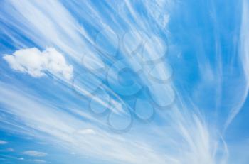 Cirrus clouds in blue windy sky, natural background photo