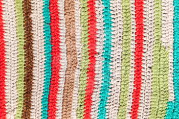 Colorful striped abstract pattern of knitted rug, background photo texture