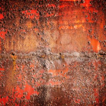 Old red rusted iron wall, square industrial background photo texture