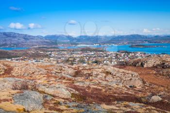 Northern Norway in springtime. Mountain landscape with red moss growing on rocks