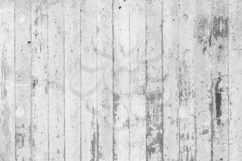 White concrete wall with relief pattern from timber formwork, background photo texture 