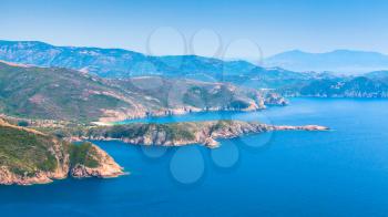 Coasal landscape of French Mediterranean island Corsica. Corse-du-Sud, Piana region. Mountains and sea in a summer day