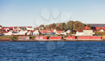 Traditional Norwegian village. Wooden houses on sea coast. Brekstad, Norway