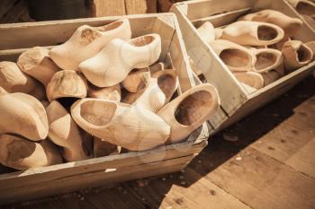 Сlogs made of poplar wood. Klompen, traditional Dutch shoes for everyday use lay in wooden boxes