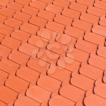 New red roof tiling, close-up square background photo texture
