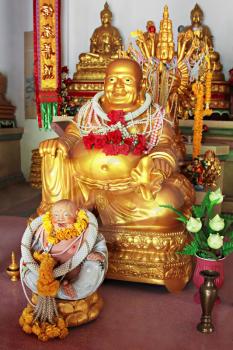 KOH-PHANGAN, THAILAND - JANUARY 18: Buddha in Kuan Yin temple on January 18, 2011, Koh-Phangan island, Thailand. Kuan Yin temple is the main buddhist temple and meditation center on Koh Phangan