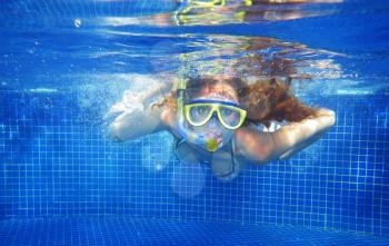 Woman with mask in pool underwater