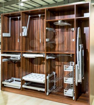 Modern empty wooden wardrobe with shelves