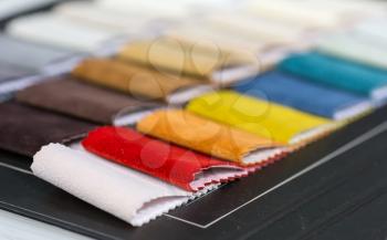 Colorful samples of different fabrics in a display