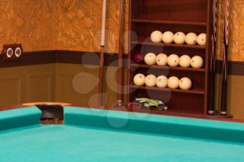 Billiards table and equipment in elegance antique interior