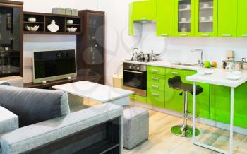 Modern light green kitchen and room clean interior design
