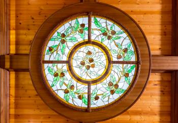 Round beautiful stained window with acorn pattern