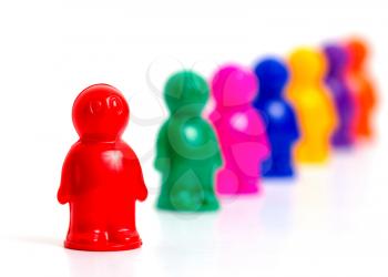 Colorful toy people group in queue on white background