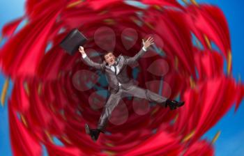 Businessman falls into abyss over red