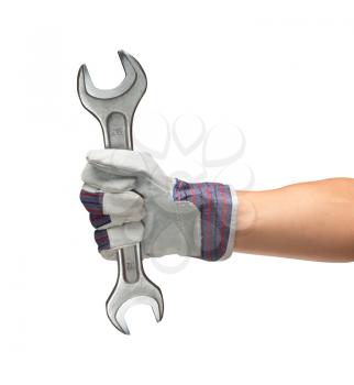 Worker hand in glove holding big spanner. Isolated on white