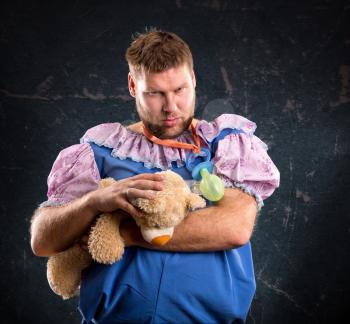 Man with toy bear in studio