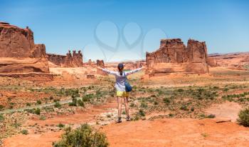 Young traveler look at monument valley. Blue sky on the background