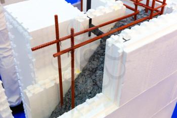 Wall construction of permanent formwork, cut view. Foam, rebar and concrete, heat-saving and sound insulation technologies