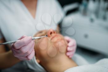 Professional facial skincare in spa salon, rejuvenation procedure, health care. Beauty medicine in cosmetology cabinet
