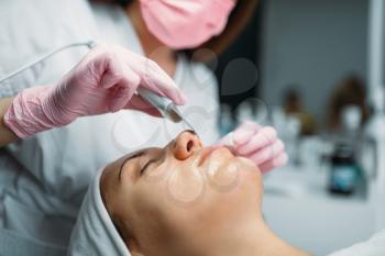 Rejuvenation procedure, getting rid of wrinkles, cosmetology clinic. Facial skincare in spa salon