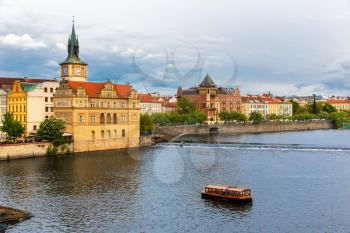 Prague cityscape, view on tower and river, Czech Republic. European town with ancient architecture buildings, famous place for travel and tourism