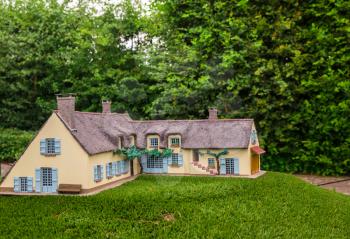 House in green forest, miniature scene outdoor, europe. Mini figures with high detaling of objects, realistically diorama