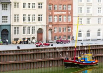 Boat, cars and summer street cafe, miniature scene outdoor, europe. Mini figures with high detaling of objects, realistically diorama