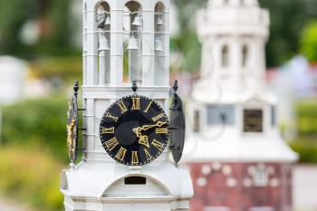 Old clock tower closeup, miniature scene outdoor, europe. Mini figures with high detaling of objects, realistically diorama