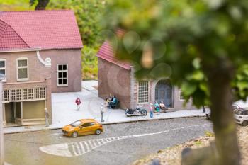 People on the street, city life, miniature scene outdoor, europe. Mini figures with high detaling of objects, realistically diorama