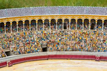 People on tribunes of the famous arena, miniature scene outdoor, europe. Mini figures with high detaling of objects, diorama