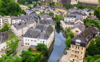 Luxembourg cityscape, ancient church on river. Old european architecture, medieval stone buildings, benelux country