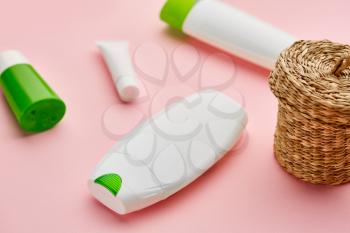 Skin care products, macro view, pink background, nobody. Morning healthcare procedures concept, hygiene tools