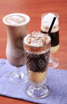 Coffee and chocolate drinks in tall glasses