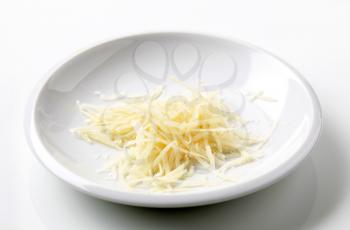 Heap of grated cheese on a plate