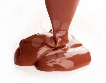 Milk chocolate sauce being poured
