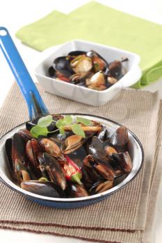 Steamed mussels in a frying pan