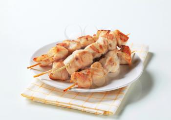 Chicken skewers on a plate
