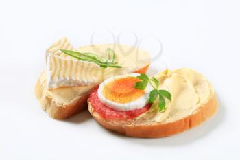 Slices of white bread with cheese and egg 