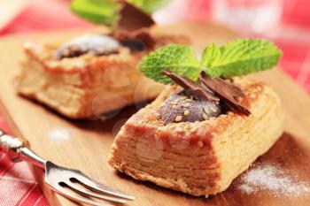 Chocolate filled puff pastry tart shell sprinkled with sesame seeds