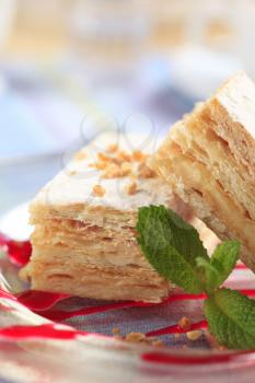 Slices of apple mille-feuille cake dusted with powdered sugar