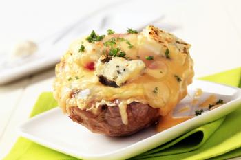 Double cheese twice baked potato sprinkled with parsley