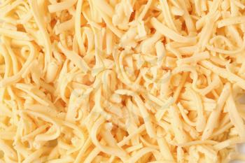 Macro of grated yellow cheese - full frame