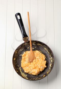 Scrambled eggs in a frying pan - overhead 