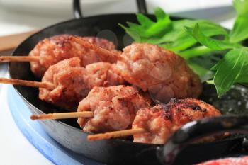 Minced meat kebabs on wooden sticks