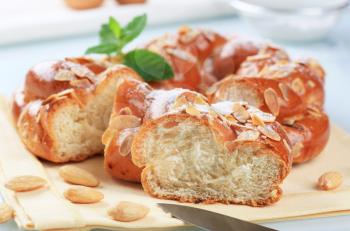 Sweet braided bread wreath topped with almonds