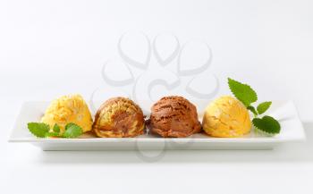 Scoops of ice cream on long dish