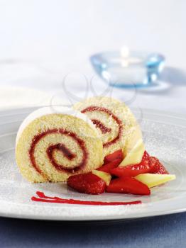 Two slices of Swiss roll with jam filling